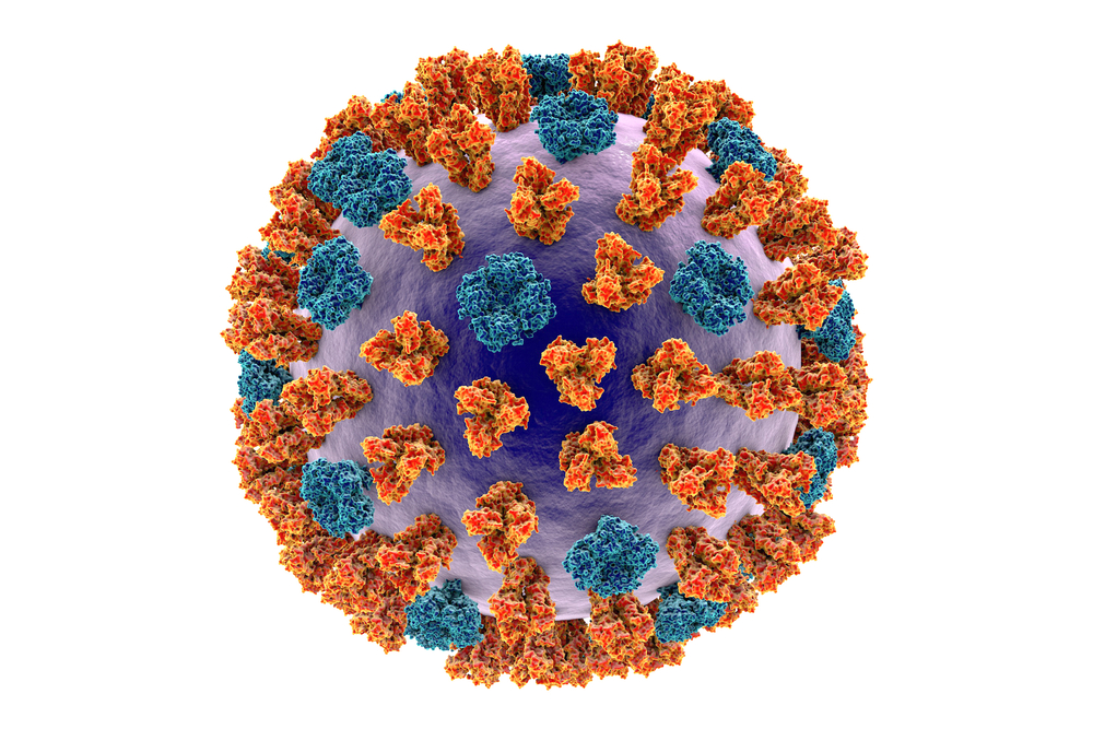 Imagem de um vírus, gerada por computador, com saliências amareladas e azuis por toda a superfície. 